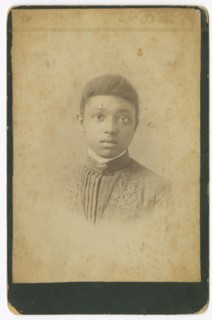 Photograph of a girl wearing a pleated dress, 1885-1900. Creator: Unknown.