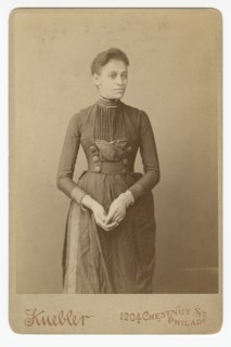 Cabinet card of a woman, 1885-1892. Creator: William J. Kuebler.