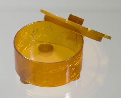 Bakelite powder box from dresser set owned by Lena Horne, mid 20th Century. Creator: Agalin.