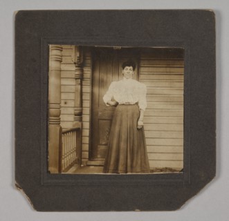 Photographic print of a woman on a porch, early 20th century. Creator: William O. Turner.