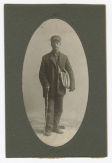 Cabinet card of a newspaper carrier, mid to late 19th century. Creator: Unknown.
