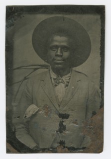 Tintype portrait of a man wearing a hat and suit, late 19th century. Creator: Unknown.