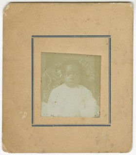 Photograph of a baby sitting in a chair, ca. 1870. Creator: Unknown.