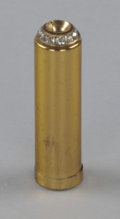 Metal lipstick holder from Mae's Millinery Shop, 1941-1994. Creator: Unknown.