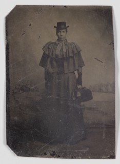 Tintype of a woman carrying a medical bag,1890s. Creator: Unknown.