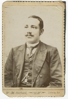 Photograph of a man wearing a dark colored suit with a pocket watch in his vest, 1886-1900. Creator: W. M. Hubbard.