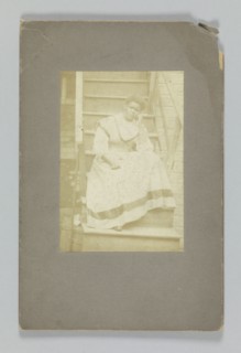 Albumen print of an unidentified woman sitting on stairs, 1850-1895. Creator: Unknown.