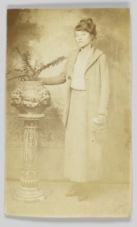 Photographic postcard of a woman, 1918-1930. Creator: The Rex Photo Studio.
