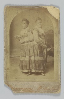 Albumen print of Millie and Christine McCoy, 1880s -1890s. Creator: Charles Eisenmann.