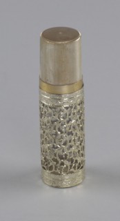 Gold and glass perfume bottle from Mae's Millinery Shop, 1941-1994. Creator: Anne Paree.