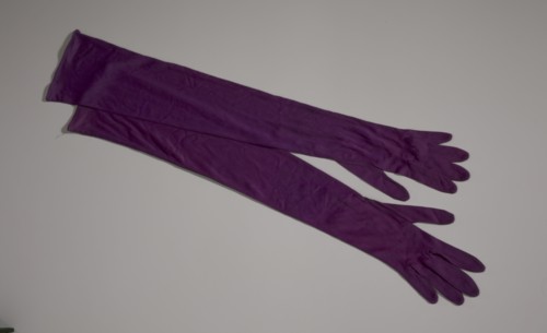 Pair of arm length purple gloves from Mae's Millinery Shop, 1941-1994. Creator: Van Raalte.