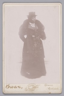 Cabinet card of an unidentified woman wearing a top hat and a fur stole, ca. 1895. Creator: Justus C. Swan.