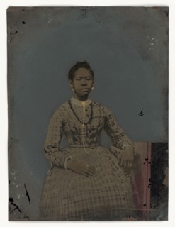 Tintype of a seated young woman, 1850-1875. Creator: Unknown.