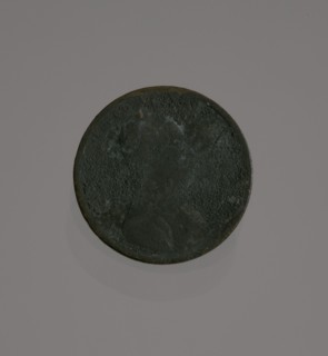 Riot penny charred during the 1921 Tulsa Race Massacre, 1909-1921. Creator: United States Mint.