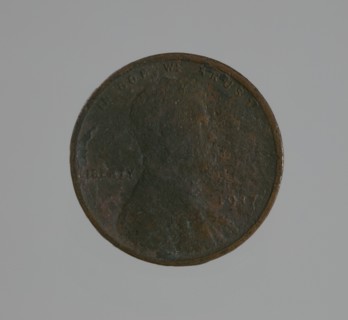 Riot penny charred during the 1921 Tulsa Race Massacre, 1917. Creator: United States Mint.