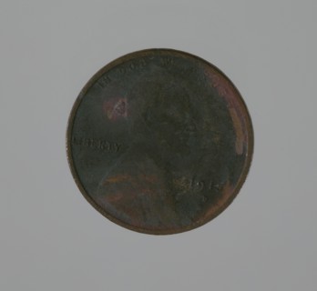 Riot penny charred during the 1921 Tulsa Race Massacre, 1915. Creator: United States Mint.