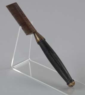 Hot comb from a travel hair care kit used by Anna Mae Queen Holmes, mid 20th century. Creator: Reck-Junior.