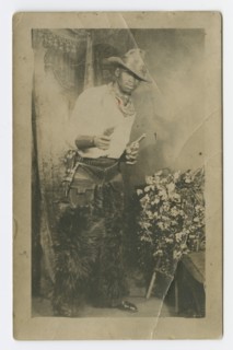 Photograph portrait of a man dressed as a cowboy, early 20th century. Creator: Unknown.