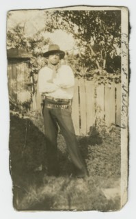 Photographic portrait of a man wearing hat and gun holster, early 20th century. Creator: Unknown.