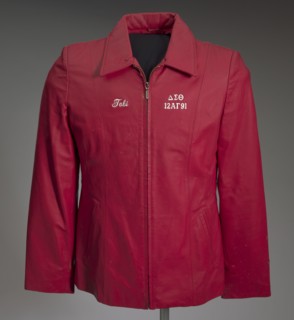 Red leather Delta Sigma Theta jacket owned by Tobi Douglas A. Pulley, 1991. Creator: La-Rose.