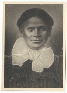 Photographic print of a woman with a large bow at her neck, ca. 1900. Creator: Unknown.