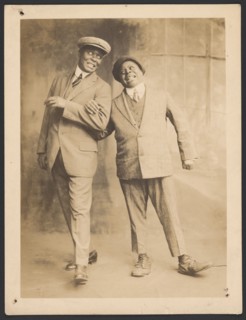 Photograph of two men linking arms, 1910s - 1920s. Creator: The Bell Studio.