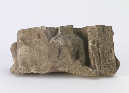 Fragment, showing torso of seated Buddha..., Period of Division, ca. 500. Creator: Unknown.