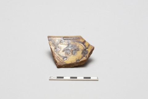 sherd, red body, white slip, yellow glaze with brown stain, Mamluk period, 1250-1516. Creator: Unknown.