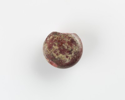 A round marker for games. Chipped, Roman period, (3rd-4th century?). Creator: Unknown.