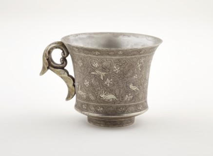 Wine cup with ring handle, birds, animals, and grape vines, Early Tang dynasty, late 7th century. Creator: Unknown.