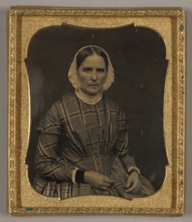 Untitled [portrait of a woman in a plaid dress], 1839/60.  Creator: Unknown.