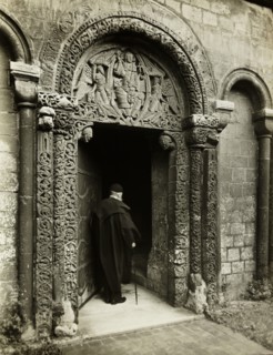 Ely Cathedral: Prior's Door, with Bedesman, 1891. Creator: Frederick Henry Evans.