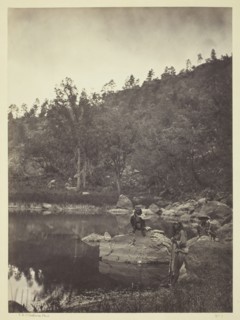 View on Apache Lake, Sierra Blanca Range, Arizona, Two Apache Scouts in the Foreground, 1873. Creator: Tim O'Sullivan.