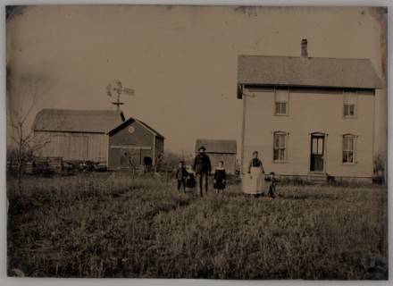 Untitled (A Man, a Woman, and Three Children Standing in Front of a Farmhouse), 1875. Creator: Unknown.