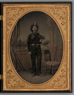 Untitled (Portrait of a Standing Man Wearing a Fireman's Uniform), 1865. Creator: Unknown.
