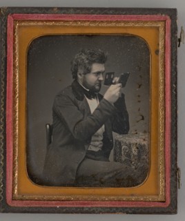 Untitled (Portrait of Man Looking Through a Stereoscope), 1856. Creator: Unknown.