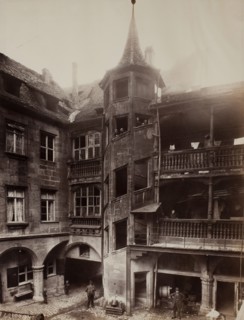 Untitled [courtyard with balconies and spiral staircase], 1870s.  Creator: Unknown.