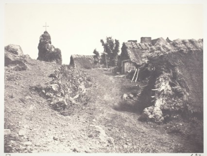 Chaumieres en Auvergne, avec un calvaire, 1852, printed 1978. Creator: Edouard Baldus.