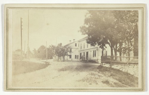 Untitled (view of road with white clapboard houses), mid-late 19th century.  Creator: T. Holmes.