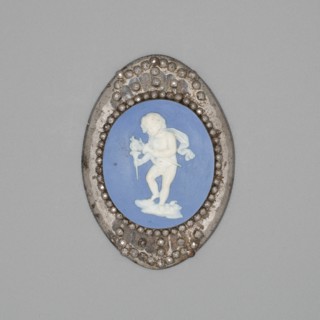 Medallion with Cupid Lighting His Wick, Burslem, Late 18th century. Creator: Wedgwood.