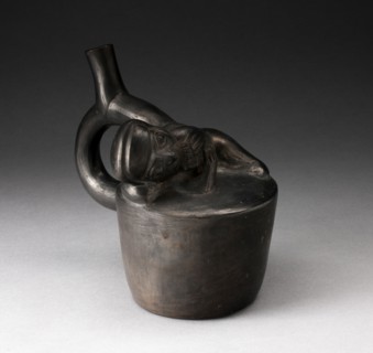 Blackware Handle Spout Vessel with Relief of a Reclining Musician with Pipes, 100 B.C./A.D. 500. Creator: Unknown.