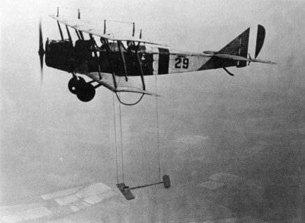 Curtiss JN-4 "Jenny" aircraft with model wing suspended, June 22, 1921. Creator: Unknown.
