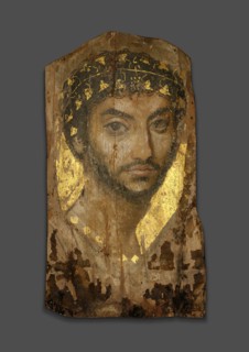 Mummy Portrait of a Man Wearing an Ivy Wreath, Fayum, Early to mid-2nd century. Creator: Unknown.