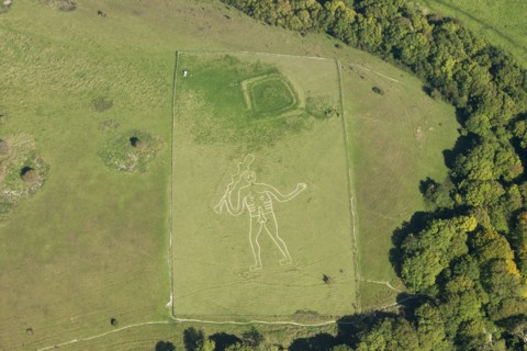 The Cerne Abbas Giant chalk hill figure and the Trendle enclosure earthwork, Dorset, 2015. Creator: Historic England.