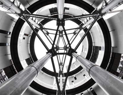 Gasholder Park, King's Cross, Camden, London, 2018. Interior view looking up through the open axis area at the centre of the three interlinked former gasholders, redeveloped as residential housing, 20...