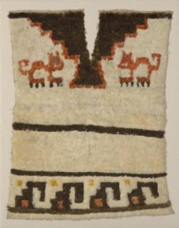 Tunic Fragment, Peru, A.D. 1470/1532. Cat motif. Embellished with feathers.