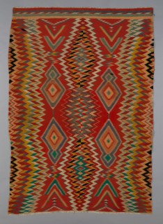 Germantown Eyedazzler Rug, Arizona, c. 1800/90. In 1864 the U.S. government forcefully resettled the Navajo in the Bosque Redondo reservation. The brightly coloured commercial yarns they received as p...
