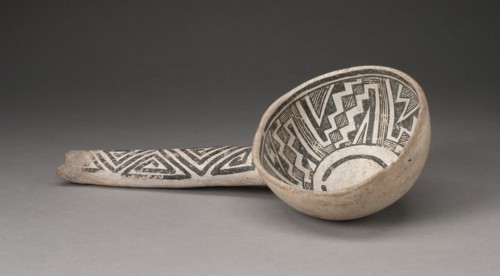 Dipper or Ladle with Interlocking Zigzag and Step-Fret Designs, A.D. 1000/1300. A ceramic vessel with a long handle, its bone-white surface decorated with black geometric designs.
