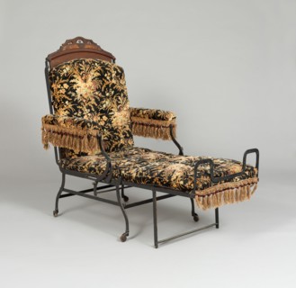 Chair, 1876. Folding chair with fringe decoration, used as an invalid chair, a smoking chair, or a bed.