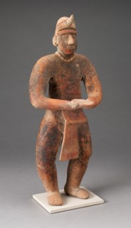 Standing Male Figure Holding a Plate, A.D. 100/400.